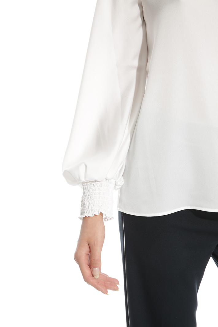 Blusa con polsini punto smock Blusa con polsini punto smock