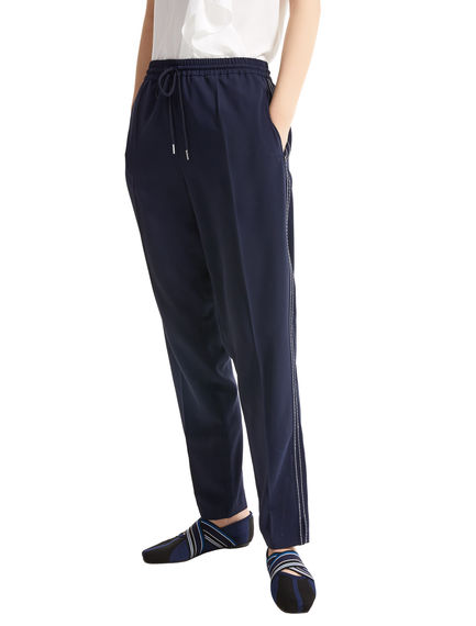 Pantaloni jogging con impunture a contrasto